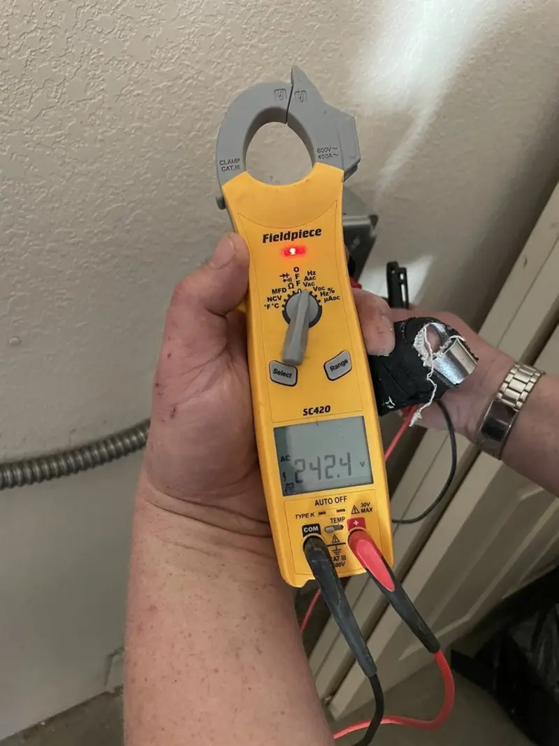 Voltage testing with clamp meter during Electrical Installation Services in Sergeant Bluff